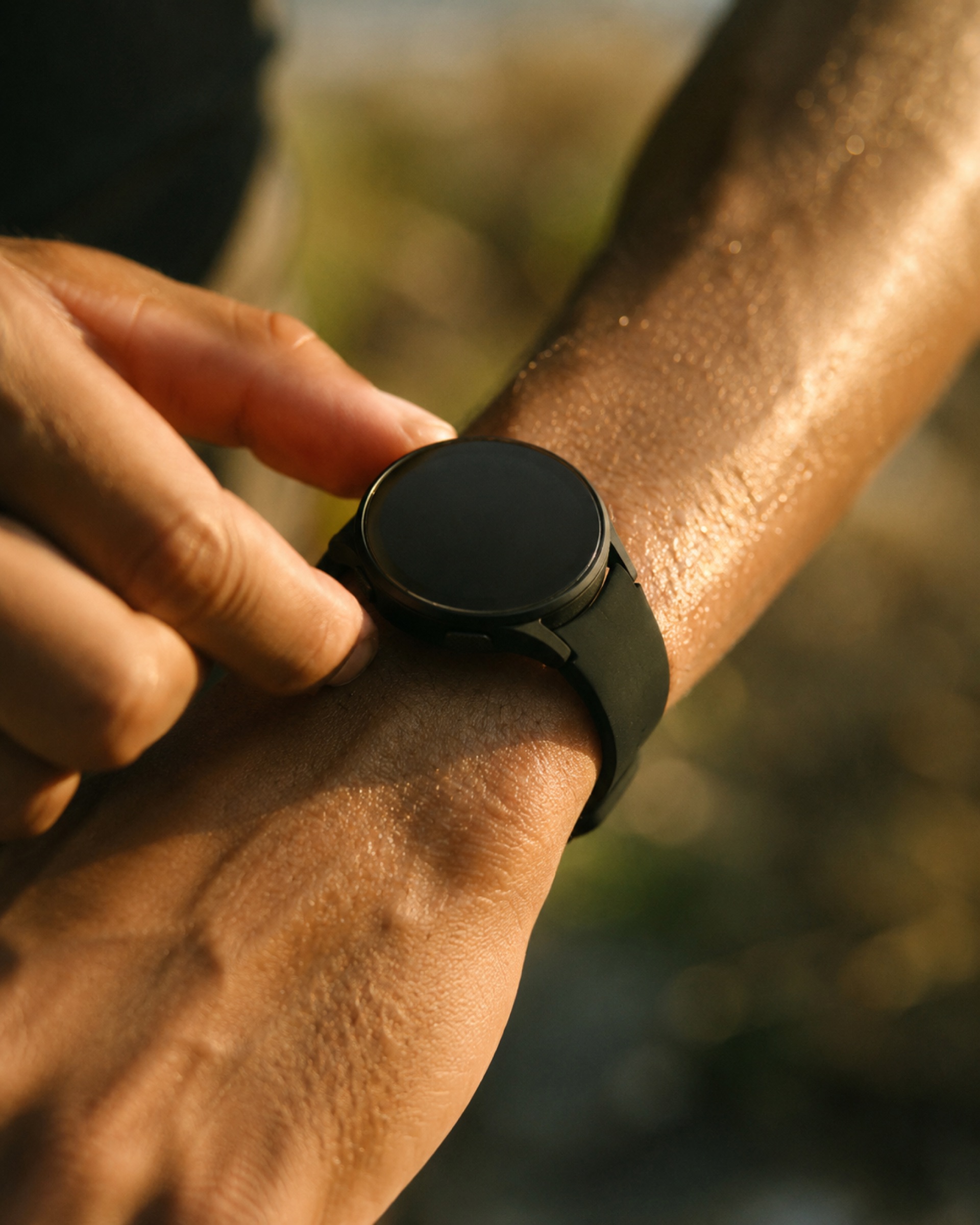 An athlete checking their wearable after a session